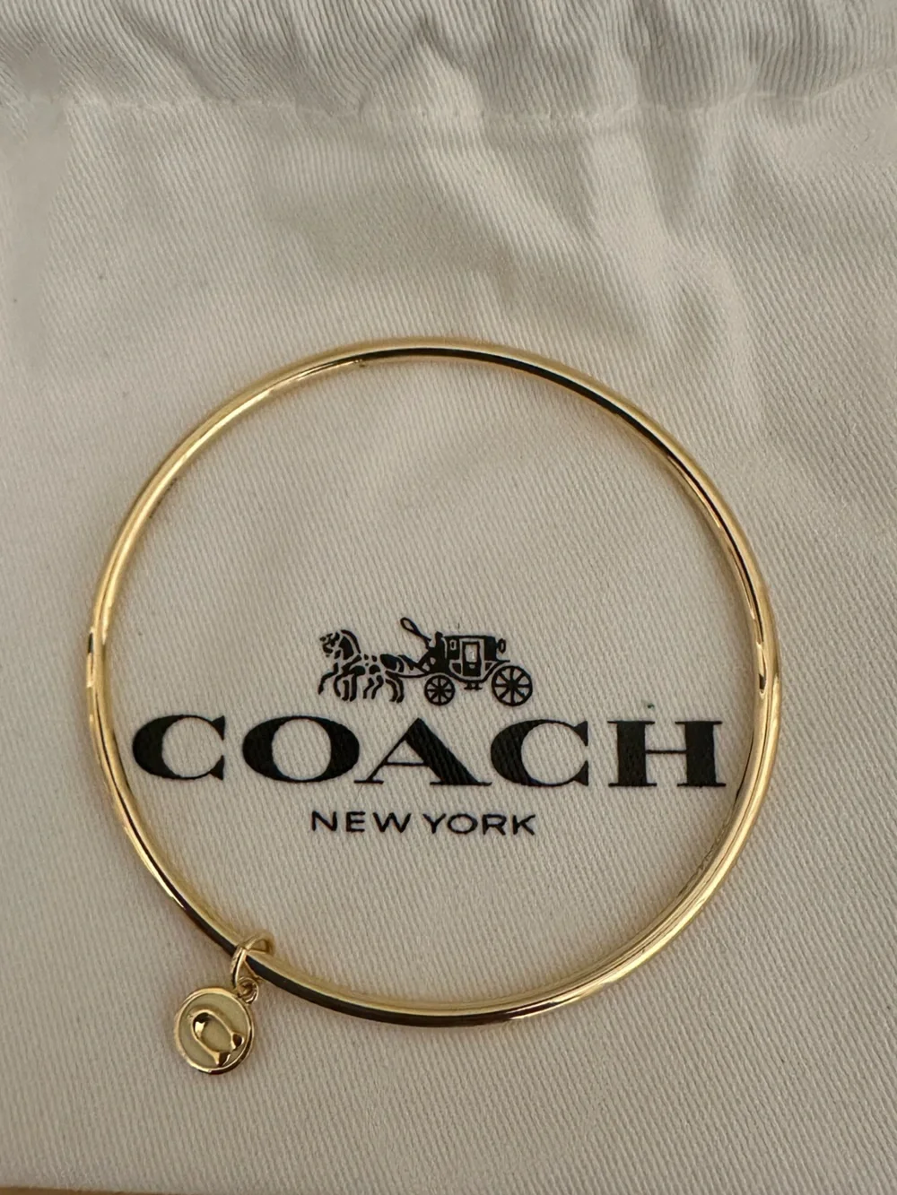 Coach Gold-tone Round Bangle with Signature Charm